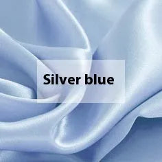 Solid colour double-sided silk duvet cover shown in bright brown, with other colour options available.