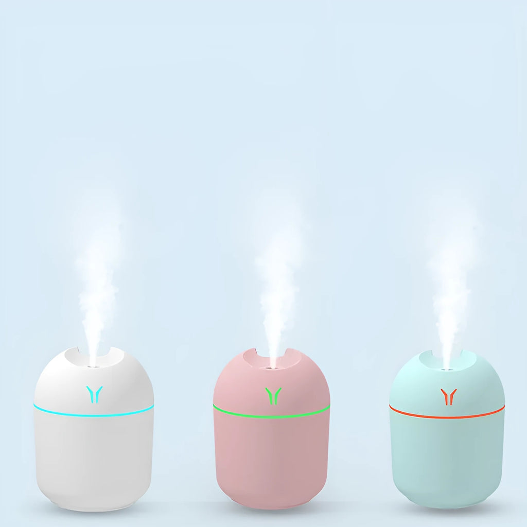 Round desktop humidifier in ivory white with USB cable and single mist outlet