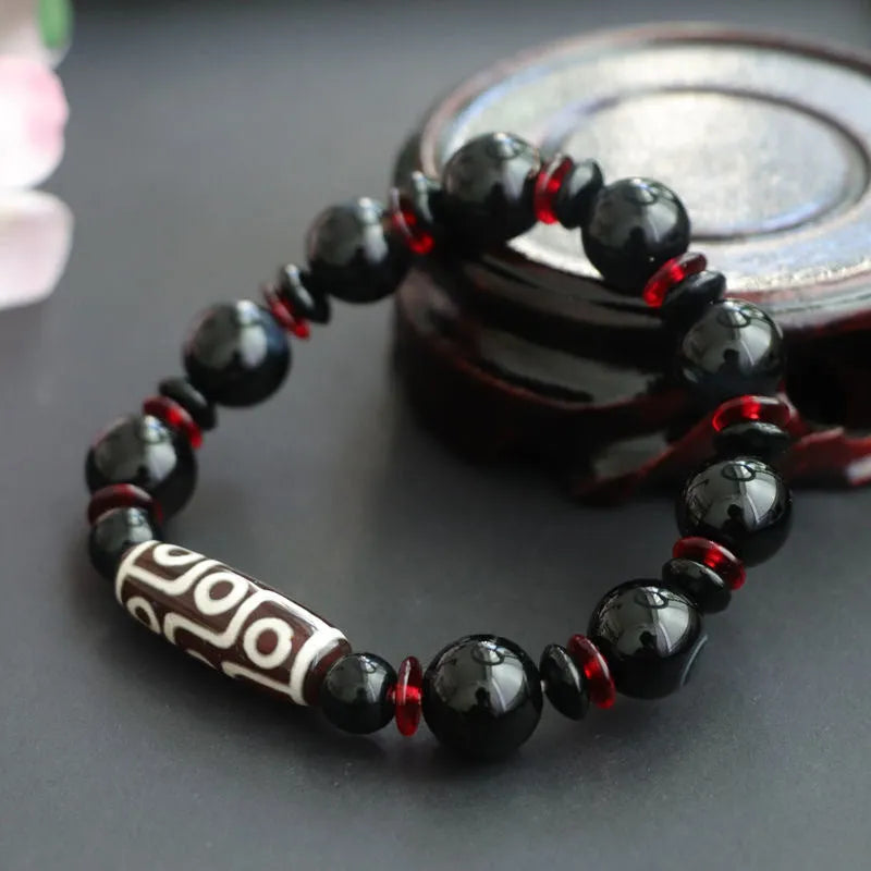 Black agate dzi bead bracelet with 11mm geometric beads in hand-woven unisex design