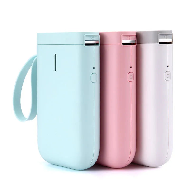 D11 Bluetooth thermal label printer in black, white, green, or pink next to a smartphone showing the label design app.