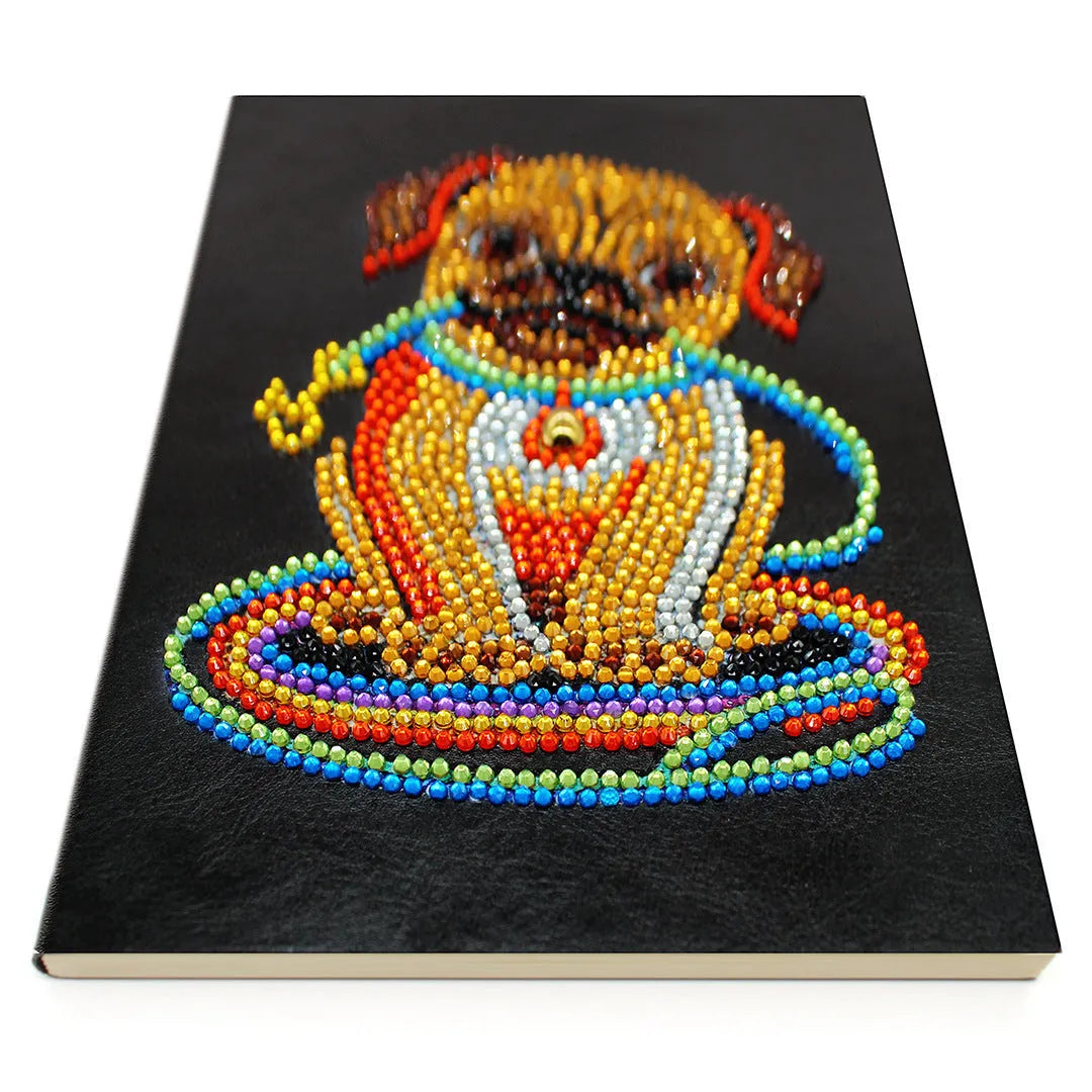 Black A5 diamond painting notebook with elastic closure showing open pages for craft organisation