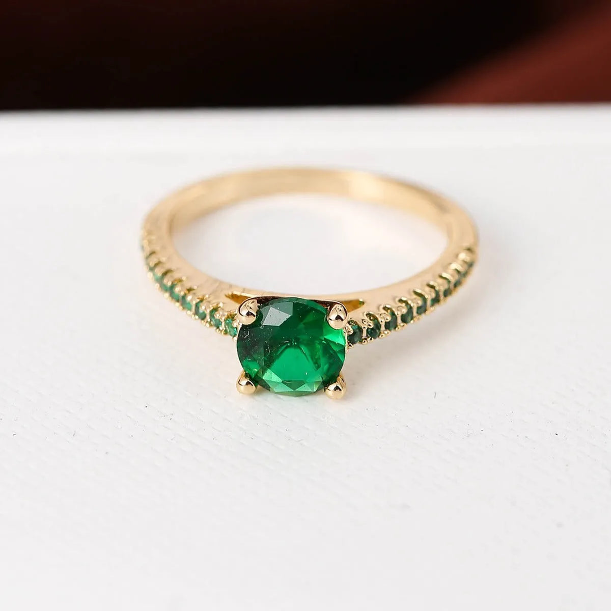 A hexagonal geometric zircon ring in a copper electroplated finish, showing one of the ten available colour options.
