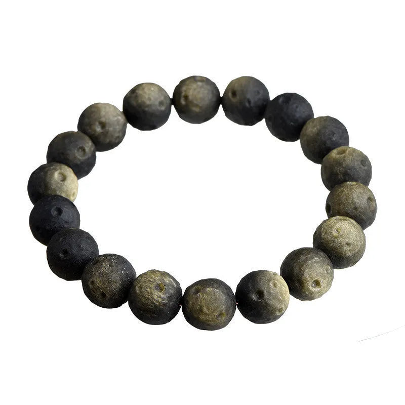 Obsidian ball bracelet with natural crater texture in silver stone meteorite colour with grinding finish