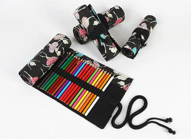 Canvas rolling pencil case with ballet girl print, showing multiple holes for colour pencils.