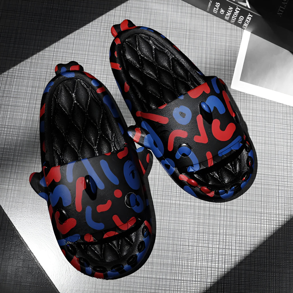 Open-toe EVA foam slippers with a shark design on the upper, shown in a beige colour.