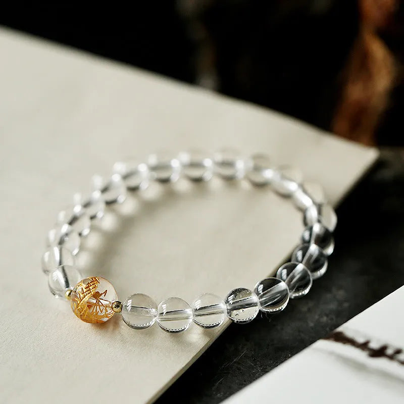 Geometric obsidian and white crystal beaded bracelet with gold dragon charm for 14-16cm wrist.