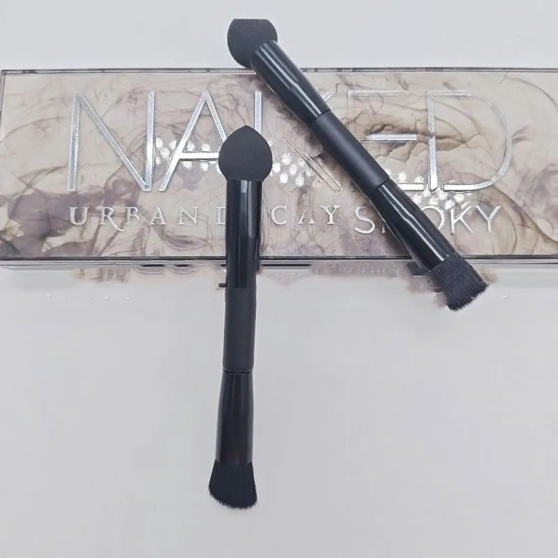 Black concealer brush with sponge tip and wooden handle for dark circle application