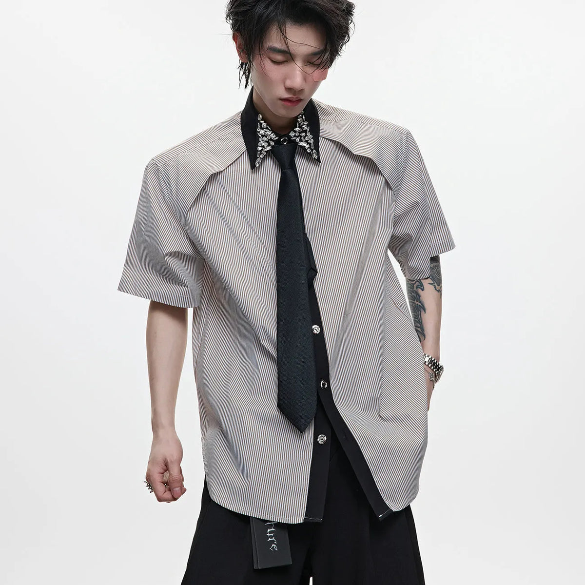 Men's blue and khaki patchwork striped shirt with quilted panels and a flip collar