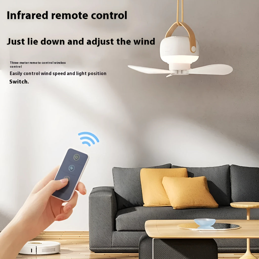 Small rechargeable camping fan with LED night light mounted in tent with remote control