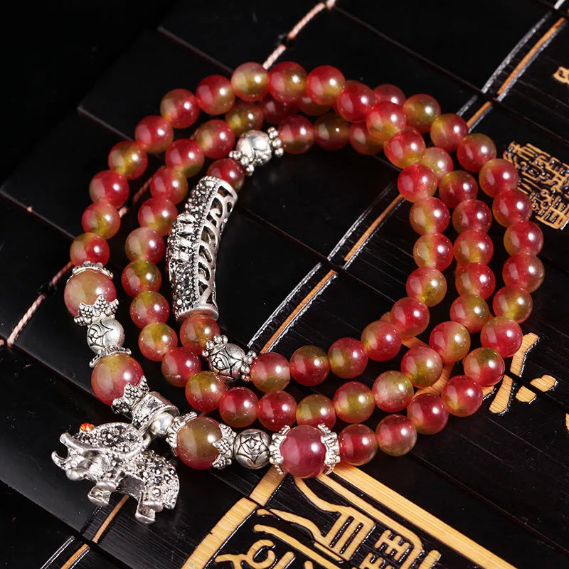 Natural watermelon crystal bracelet with Chinese knot closure and geometric beads