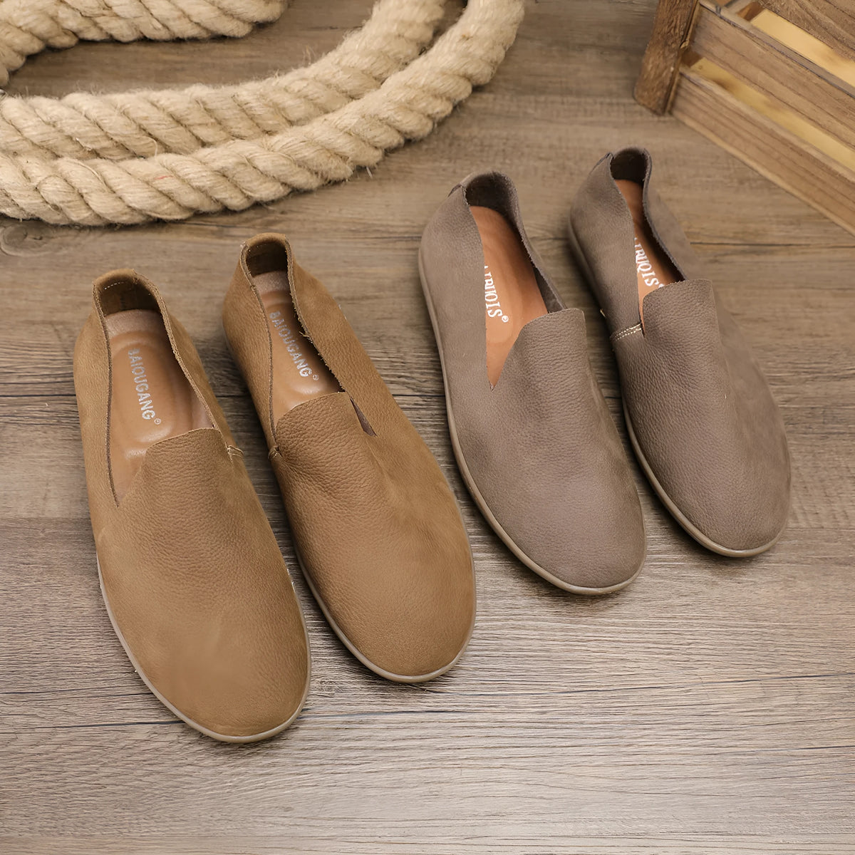 Handmade grey low-top men's shoes with a flat wedge heel and rubber sole.