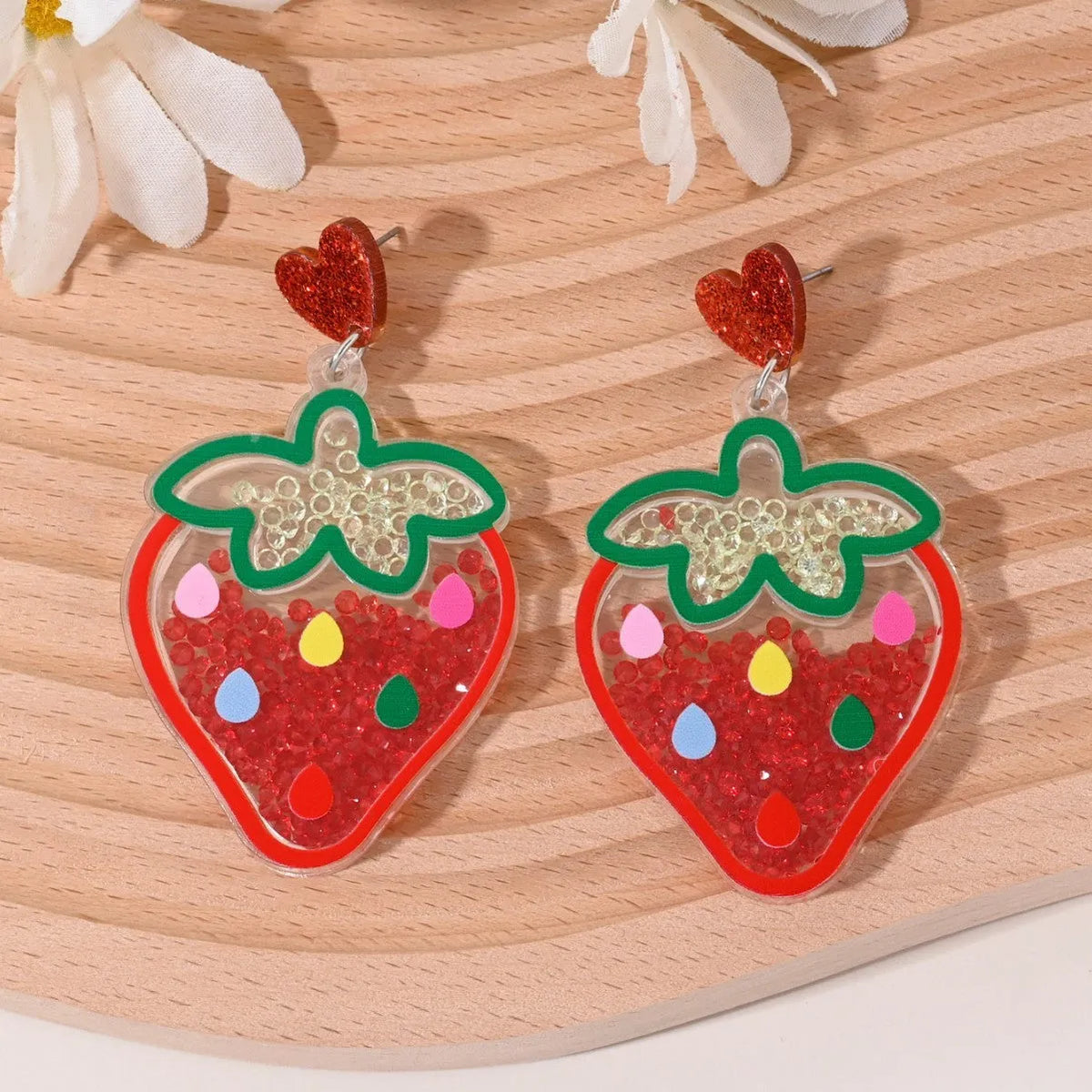 A pair of acrylic earrings shaped like a cherry, strawberry, watermelon, pineapple, coconut cake, or ice cream.
