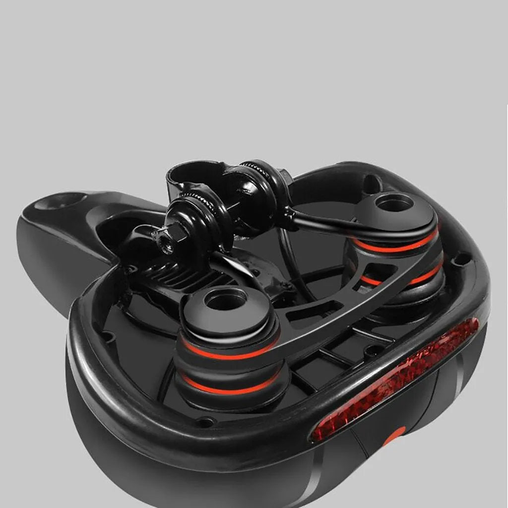 Hollow seat cushion bicycle saddle with PU leather cover, memory foam pad, and PP base, 26x21cm, in blue, red, or yellow.