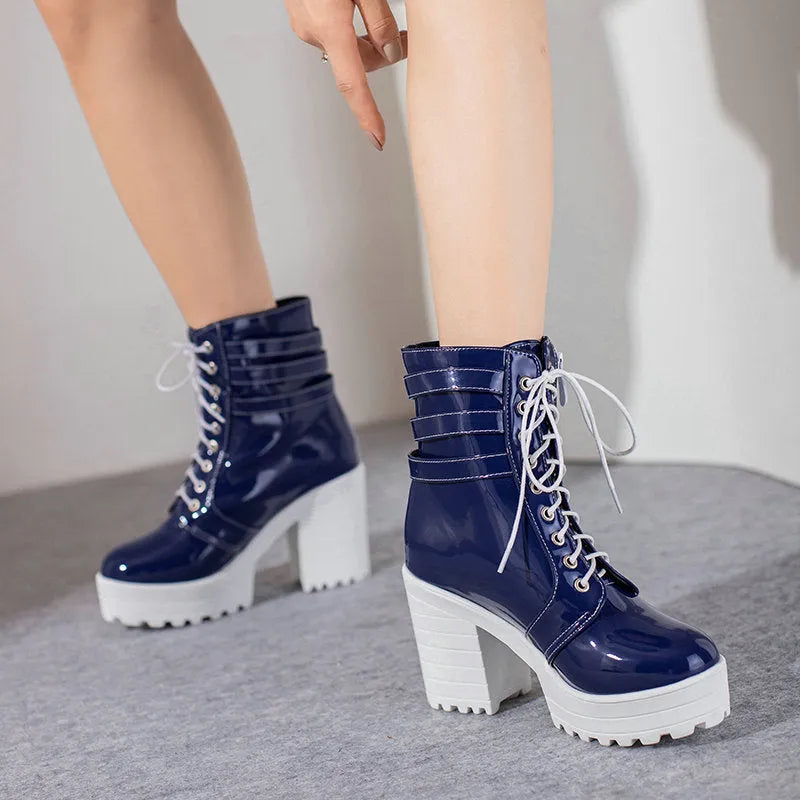 Women's black thick-heeled short boots with lace-up front and waterproof platform on a rubber sole.