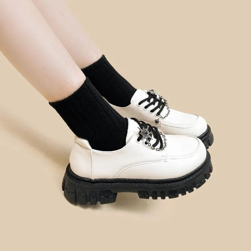 Women's Duke Asterism loafers with a metal cross strap and round toe in preppy college style.