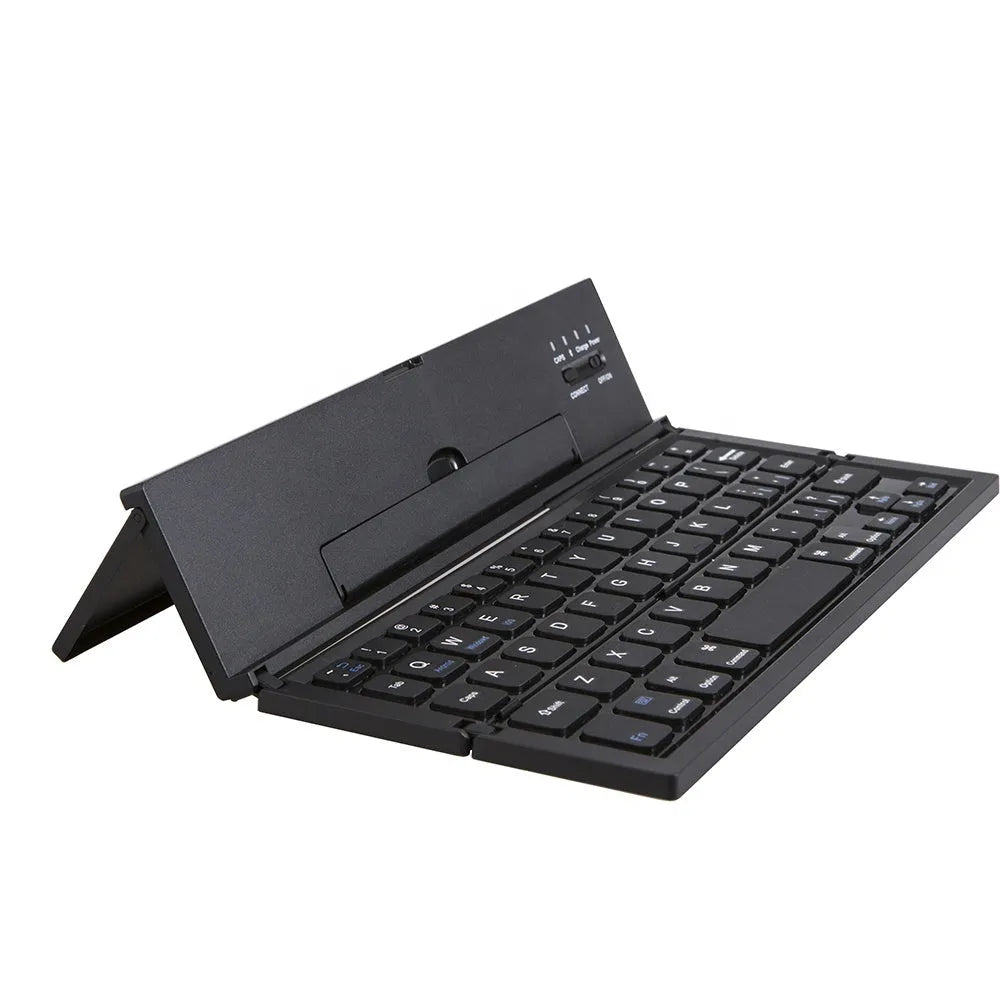 Black mini folding Bluetooth keyboard with bamboo pattern beside 7-inch tablet