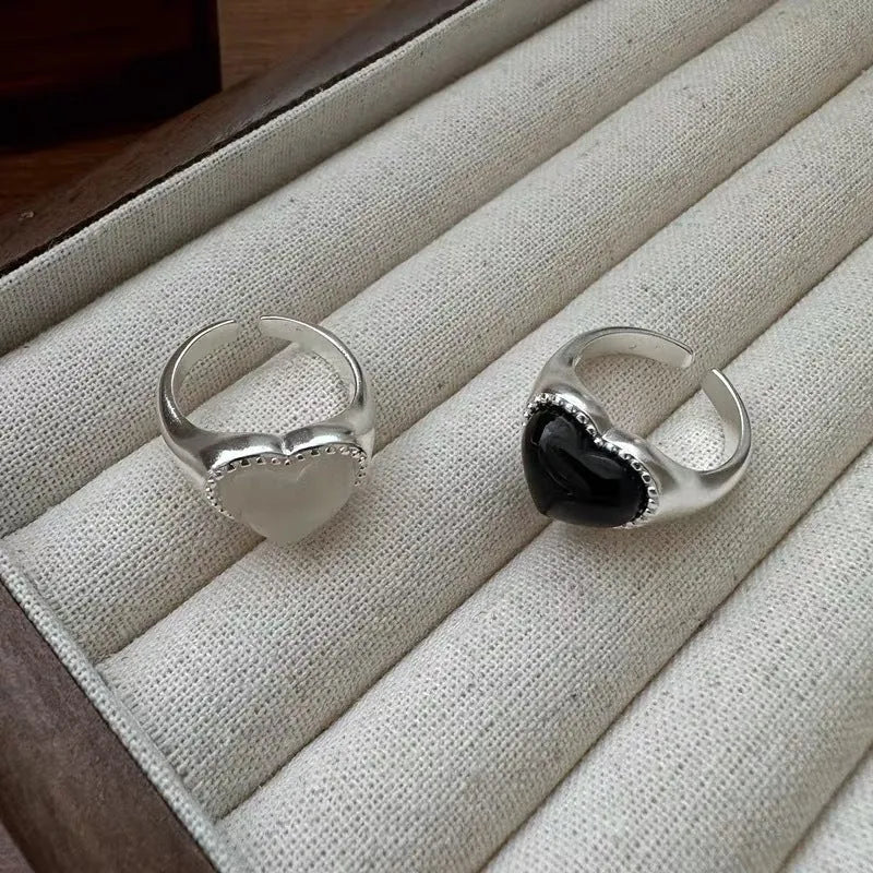S925 sterling silver adjustable ring with black agate heart in open mouth design.