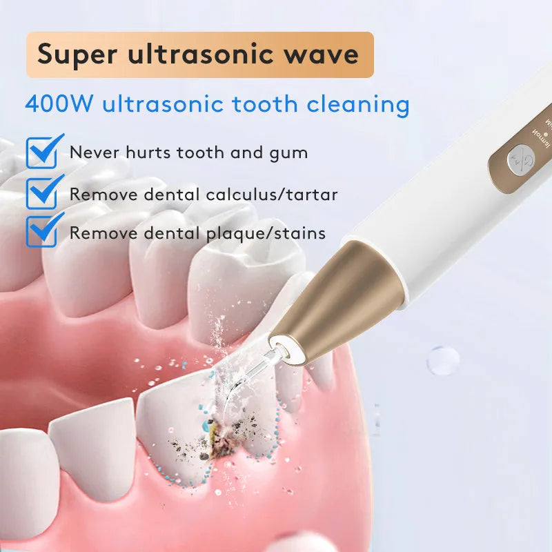Gold-coloured ultrasonic tooth cleaner for tartar and stain removal at home