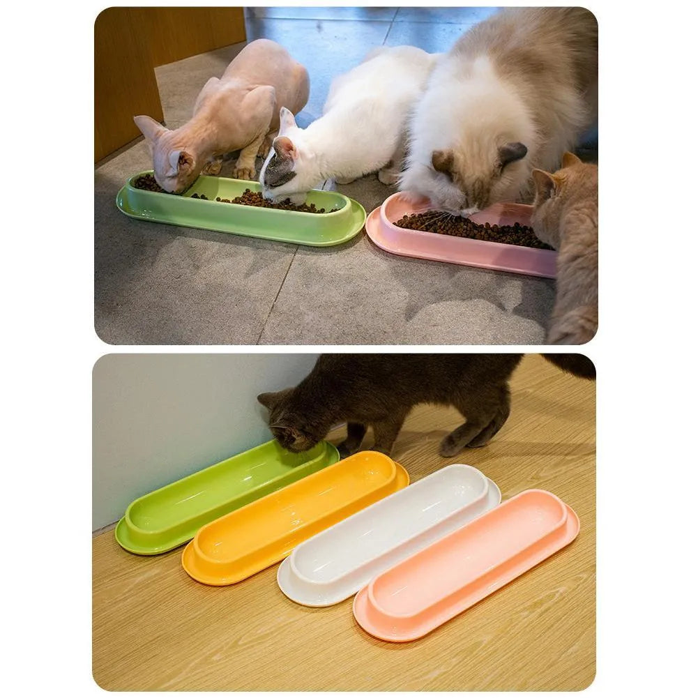 Green plastic pet feeder with separate food and water bowls for multiple small dogs or cats.