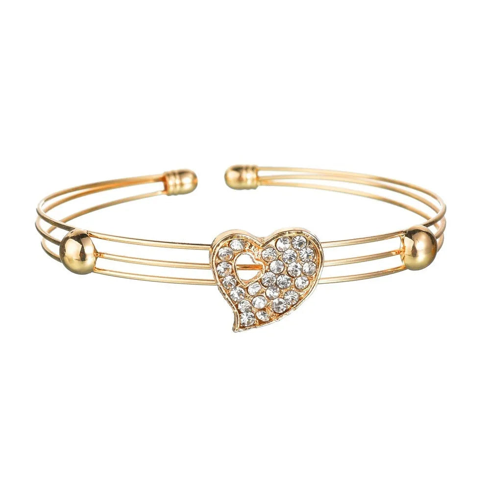 Gold electroplated alloy jewellery set with European styling featuring love, water drop and bell patterns