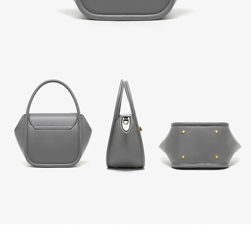 Soft cow leather wing-shaped tote handbag with a buckle latch and single cross-body shoulder strap.