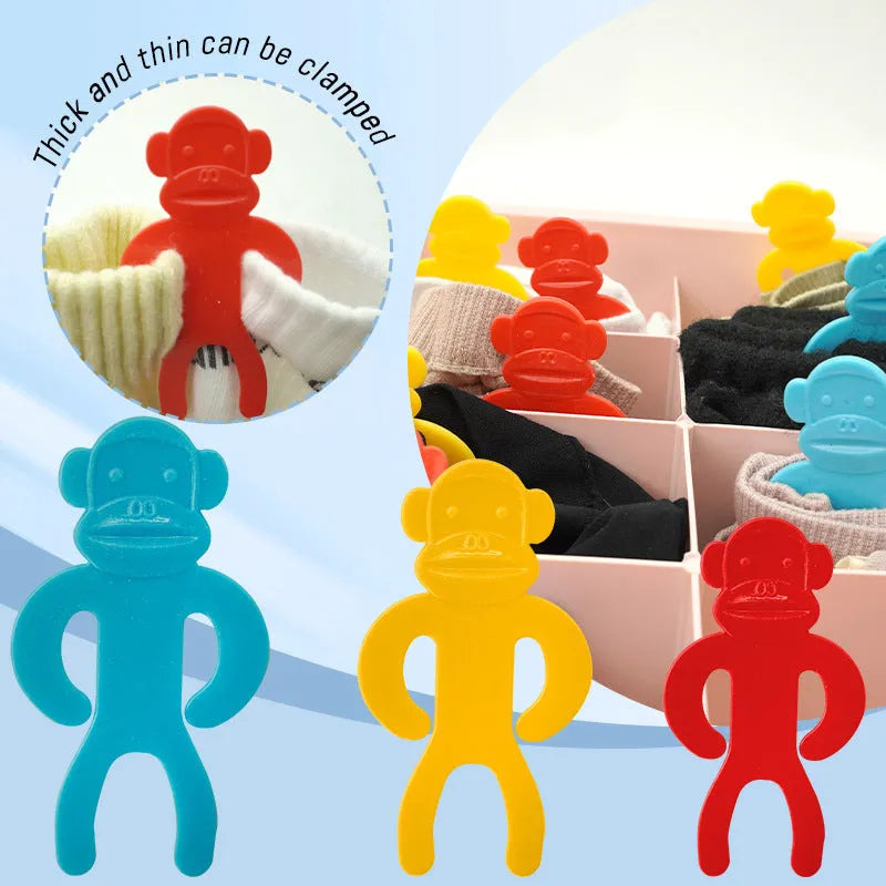 Plastic sock storage clips in blue, yellow and red colours for machine washing organisation