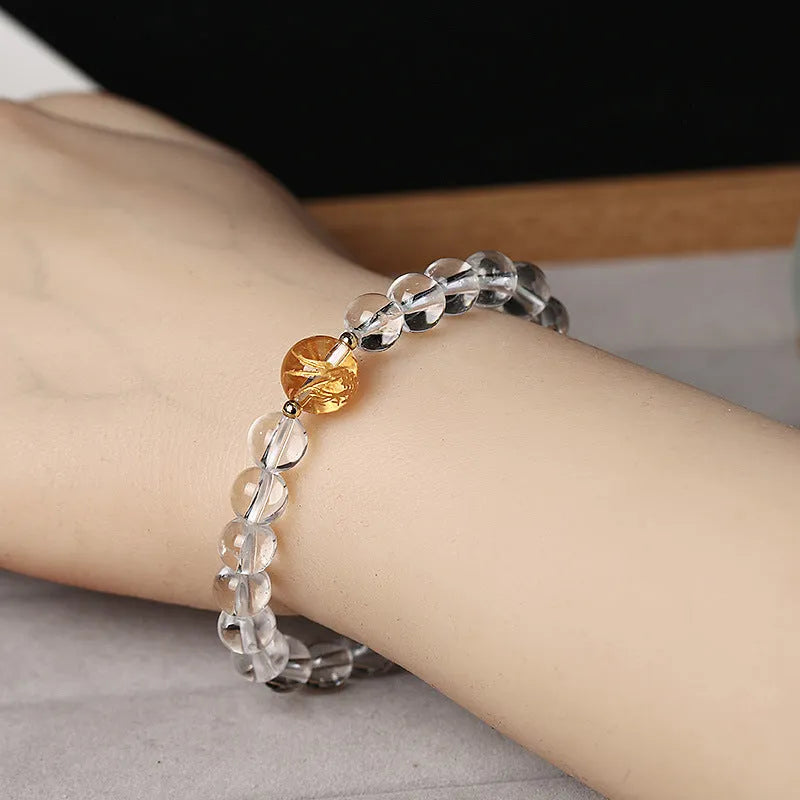 Geometric obsidian and white crystal beaded bracelet with gold dragon charm for 14-16cm wrist.