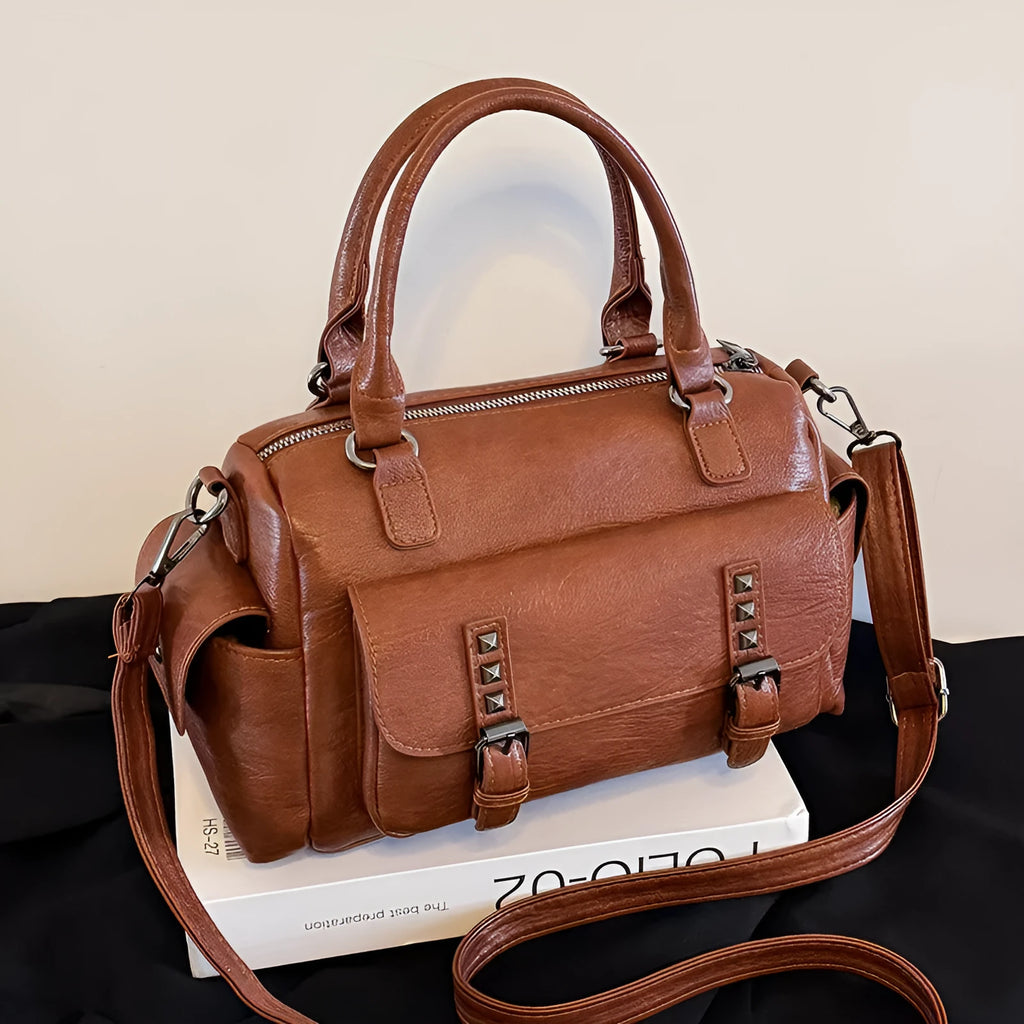 Vintage messenger bag in horizontal square shape with contrast stitching, shown in available colour options