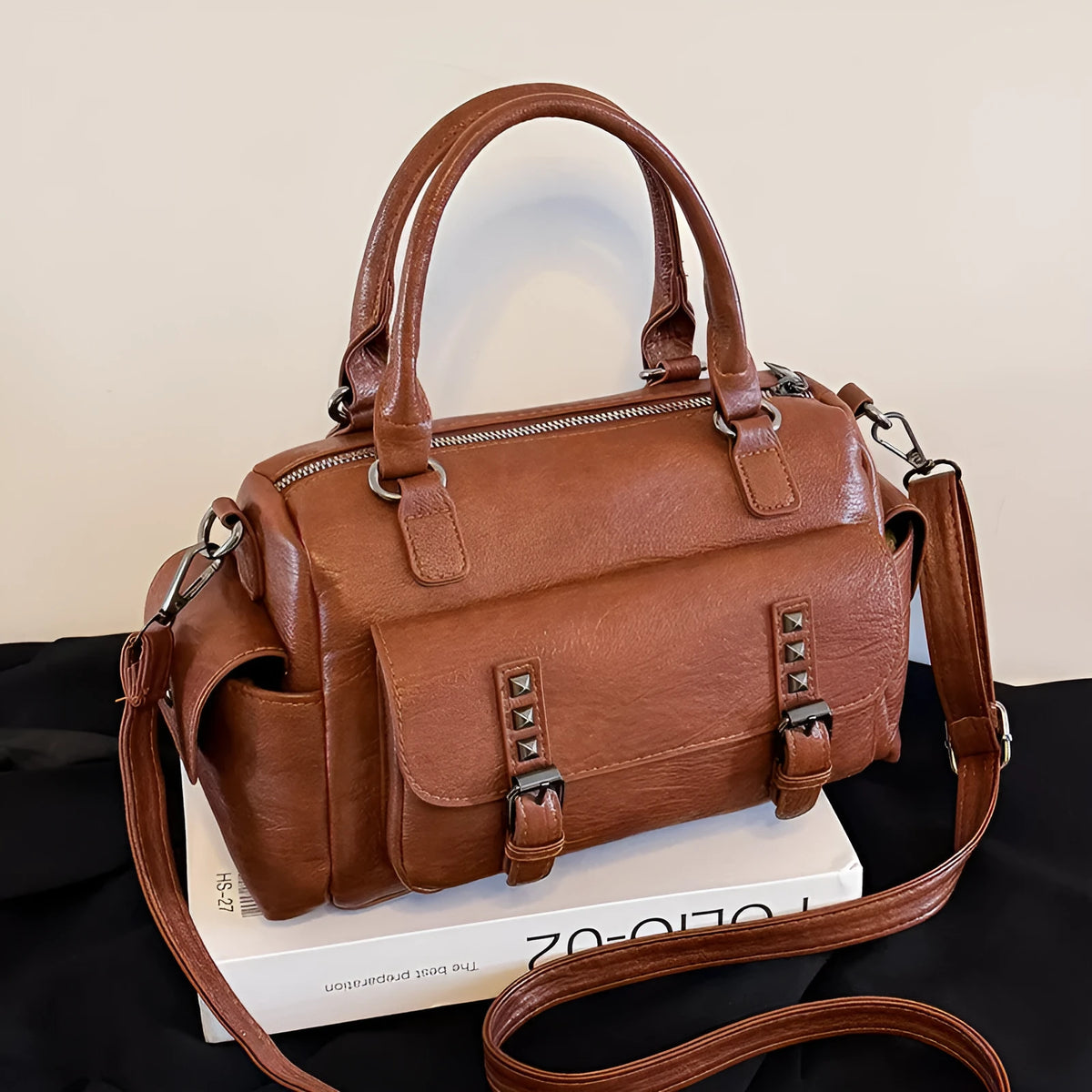 Vintage messenger bag in horizontal square shape with contrast stitching, shown in available colour options
