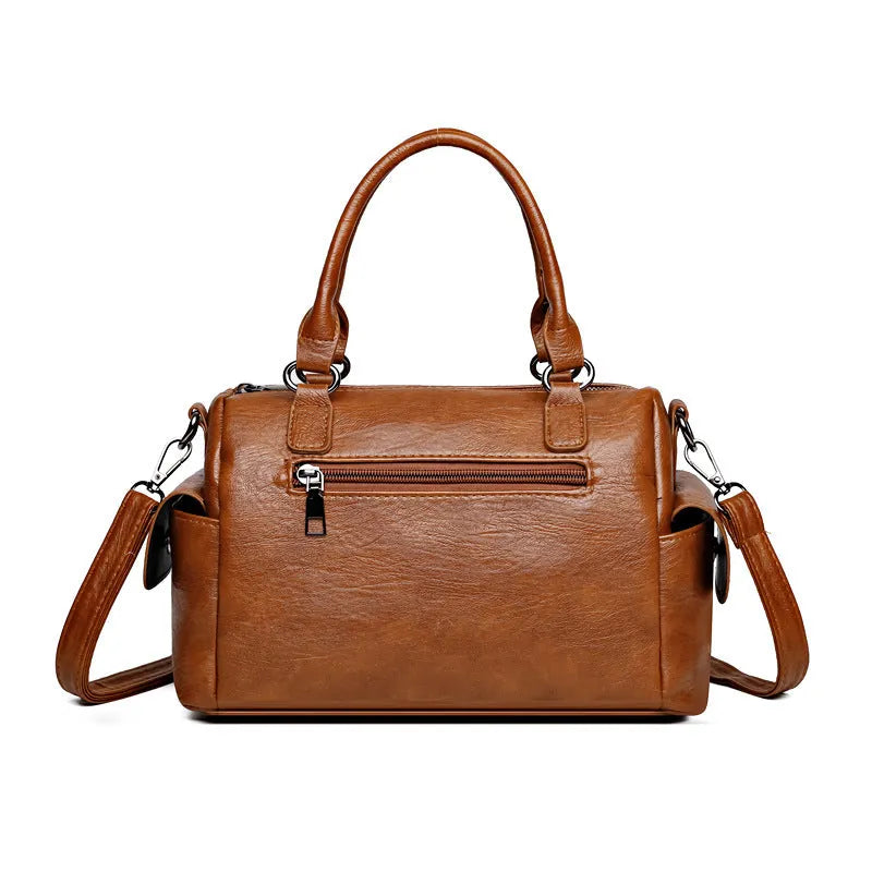 Vintage messenger bag in horizontal square shape with contrast stitching, shown in available colour options