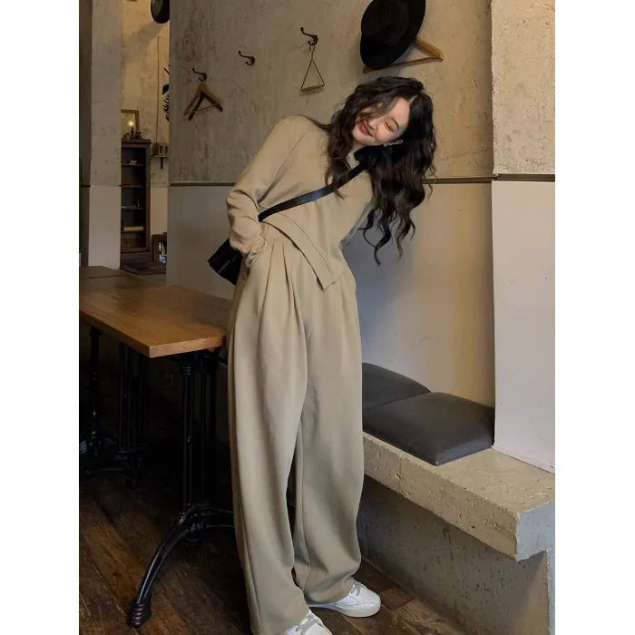 Brown loose-fit women's polyester sports suit with long sleeves and full-length trousers.