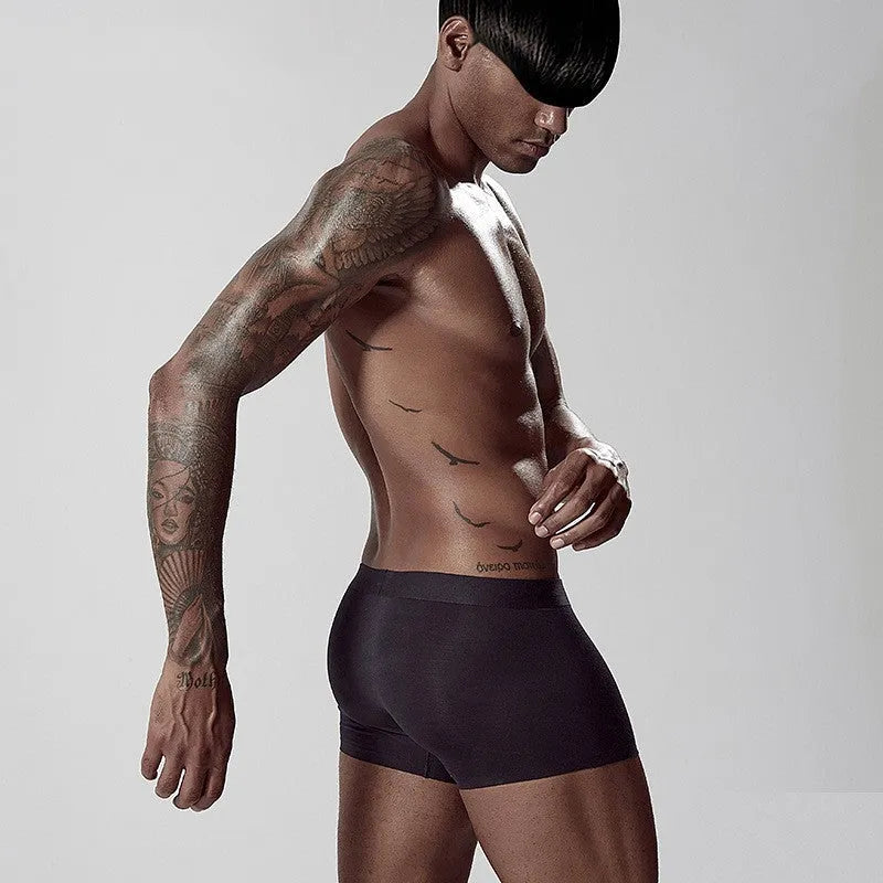 Men's seamless modal underwear in mid-waist style showing white, pink, and green colour options