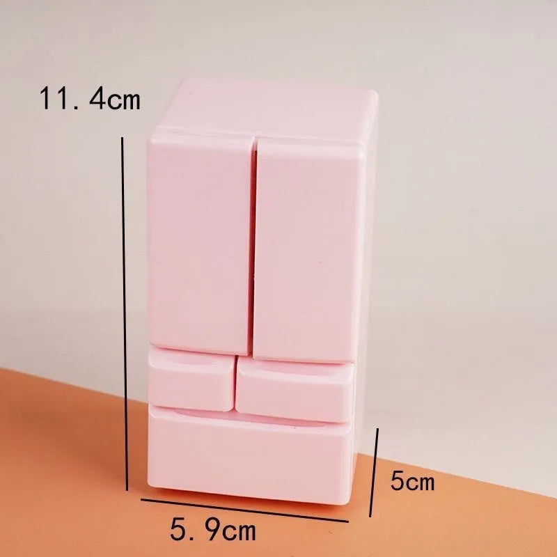 White plastic miniature candy toy model with lights on, showing detailed scene.