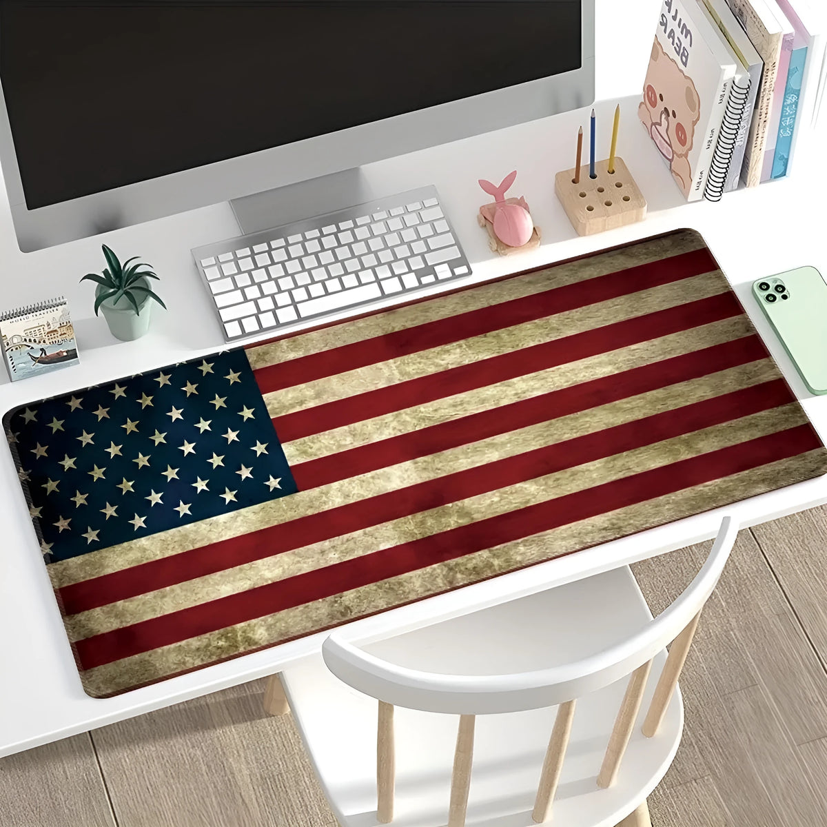 Large printed desk pad mouse mat with natural rubber non-slip base on a wooden desk.