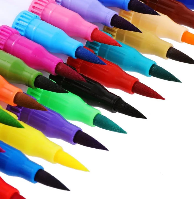 Watercolour pen set showing multiple colours creating ink wash effects on paper