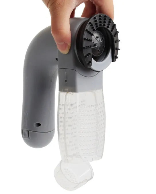Grey portable electric pet hair vacuum cleaner with grooming brush.