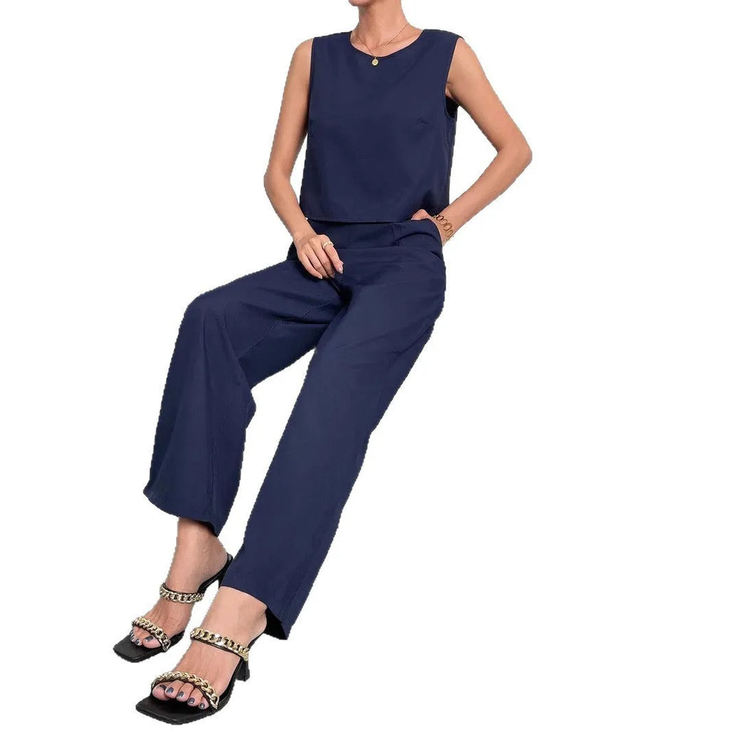 Red polyester two-piece set with sleeveless round neck top and wide leg trousers