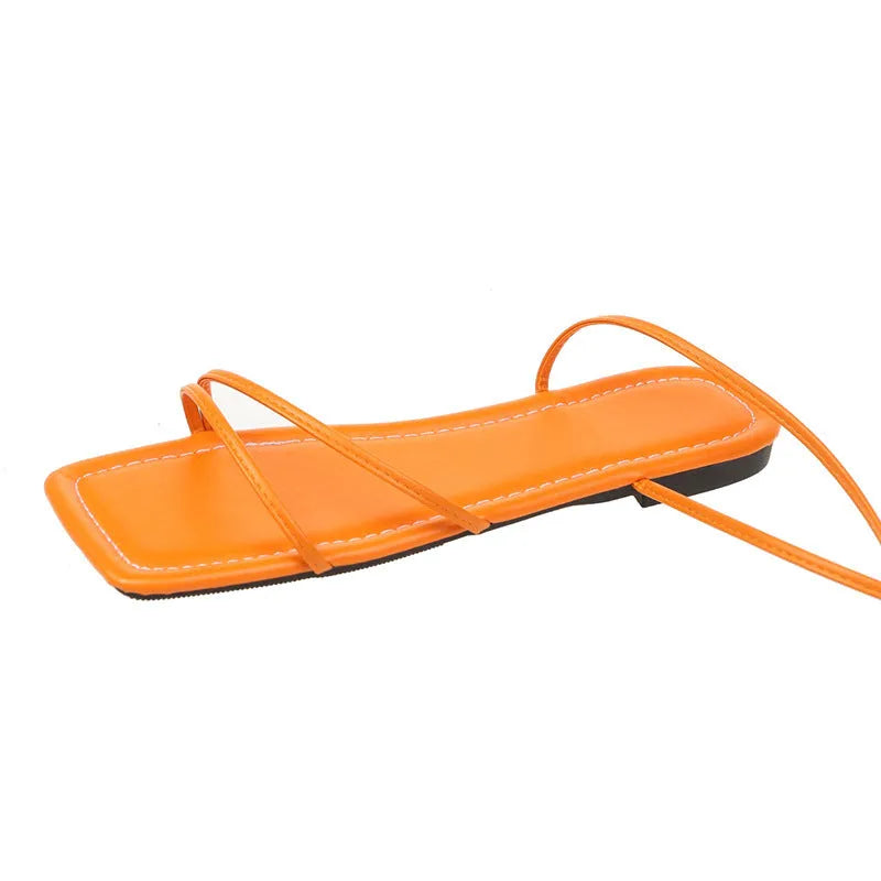 Women's flat sandals with ankle ring bandage detail and front lace-up closure in solid colour