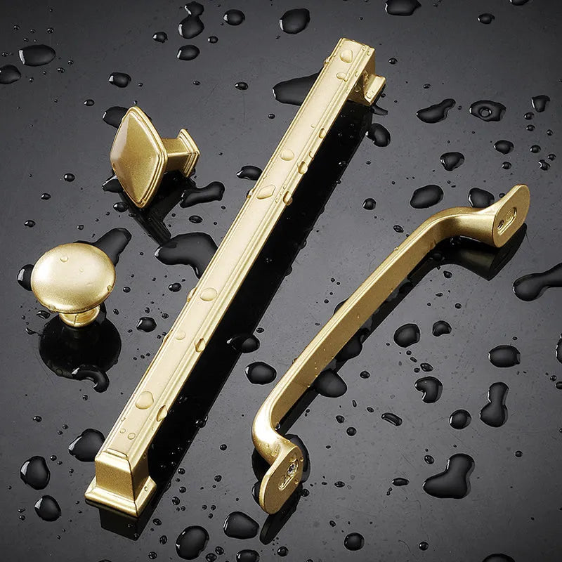 Gold aluminium T-shaped single hole cabinet handle shown from the side