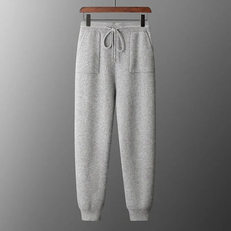 Men's light grey cashmere hoodie and joggers set displayed together as coordinated winter leisurewear