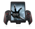 PG-9023 black telescopic wireless game controller extended with a mobile phone attached in the centre