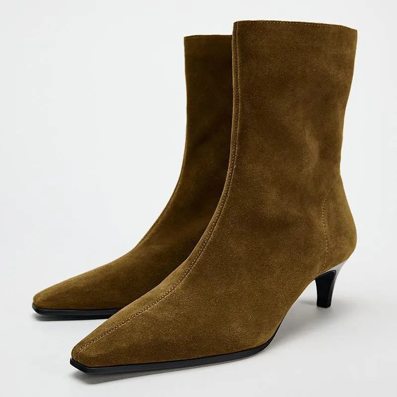 Women's brown square toe mid-calf boots with side zipper and retro kitten heel on wooden floor