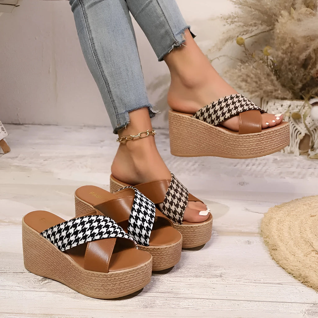 Brown and black plaid pattern casual wedge sandals with a rubber sole.