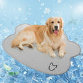 Ice silk pet cooling mat in dog head shape, shown in light gray, on a wooden floor