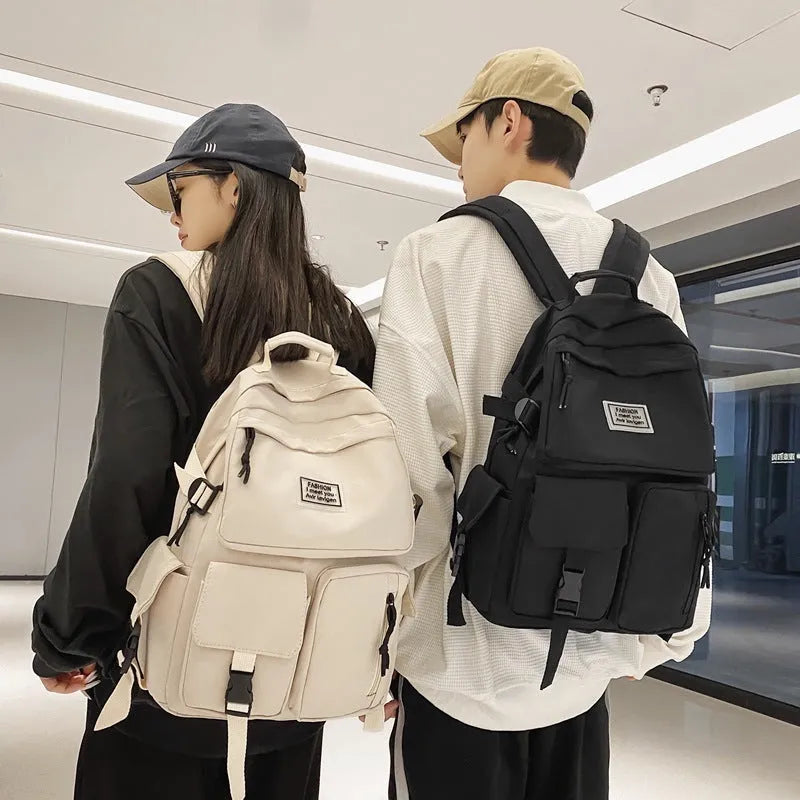 Black and white nylon student backpack with laptop compartment and external pockets