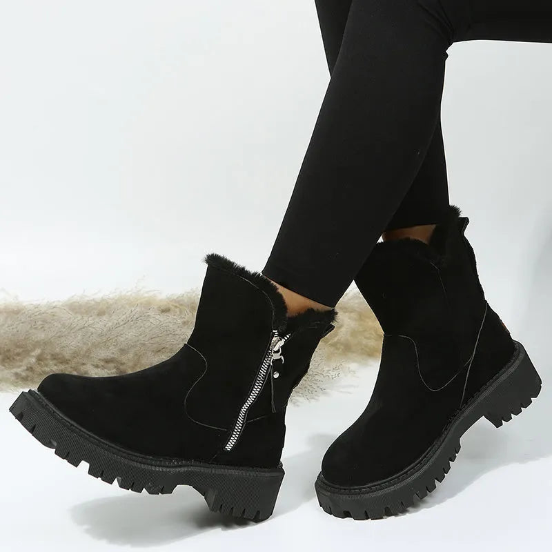 Women's black faux suede high-top snow boots with side zip and non-slip rubber sole.