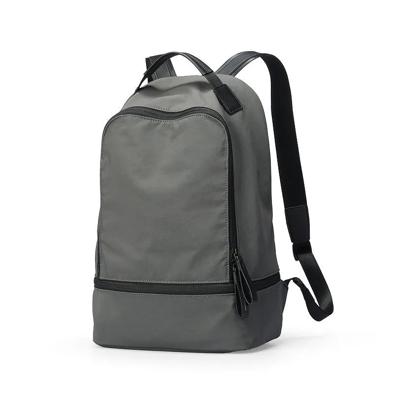 Lightweight Oxford cloth backpack in solid colour with 20L capacity for travel and commuter use