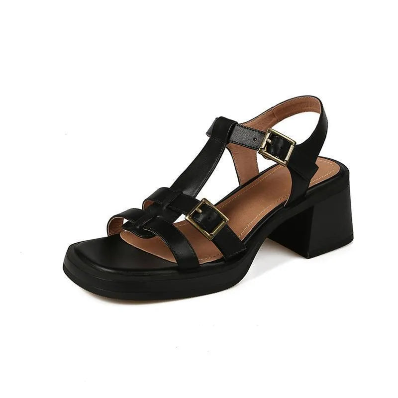 Black retro women's sandals with T-buckle, chunky platform heel and open square toe.