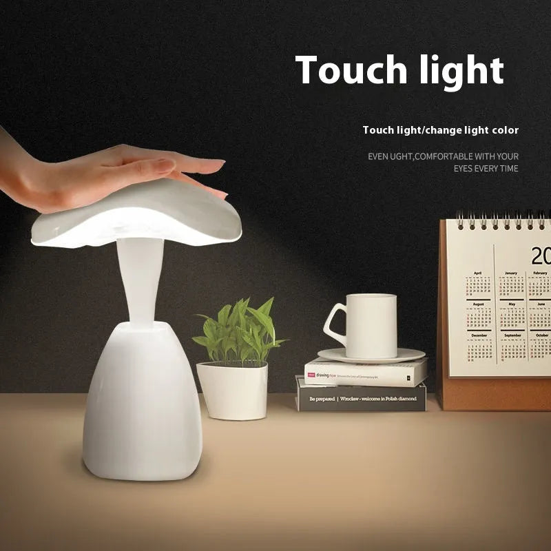 White modern LED desk lamp with touch controls and rechargeable battery for bedside use