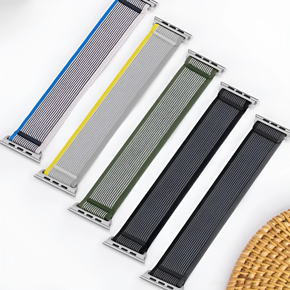 Integrated single-ring nylon Apple Watch strap shown in multiple colour options on a watch.